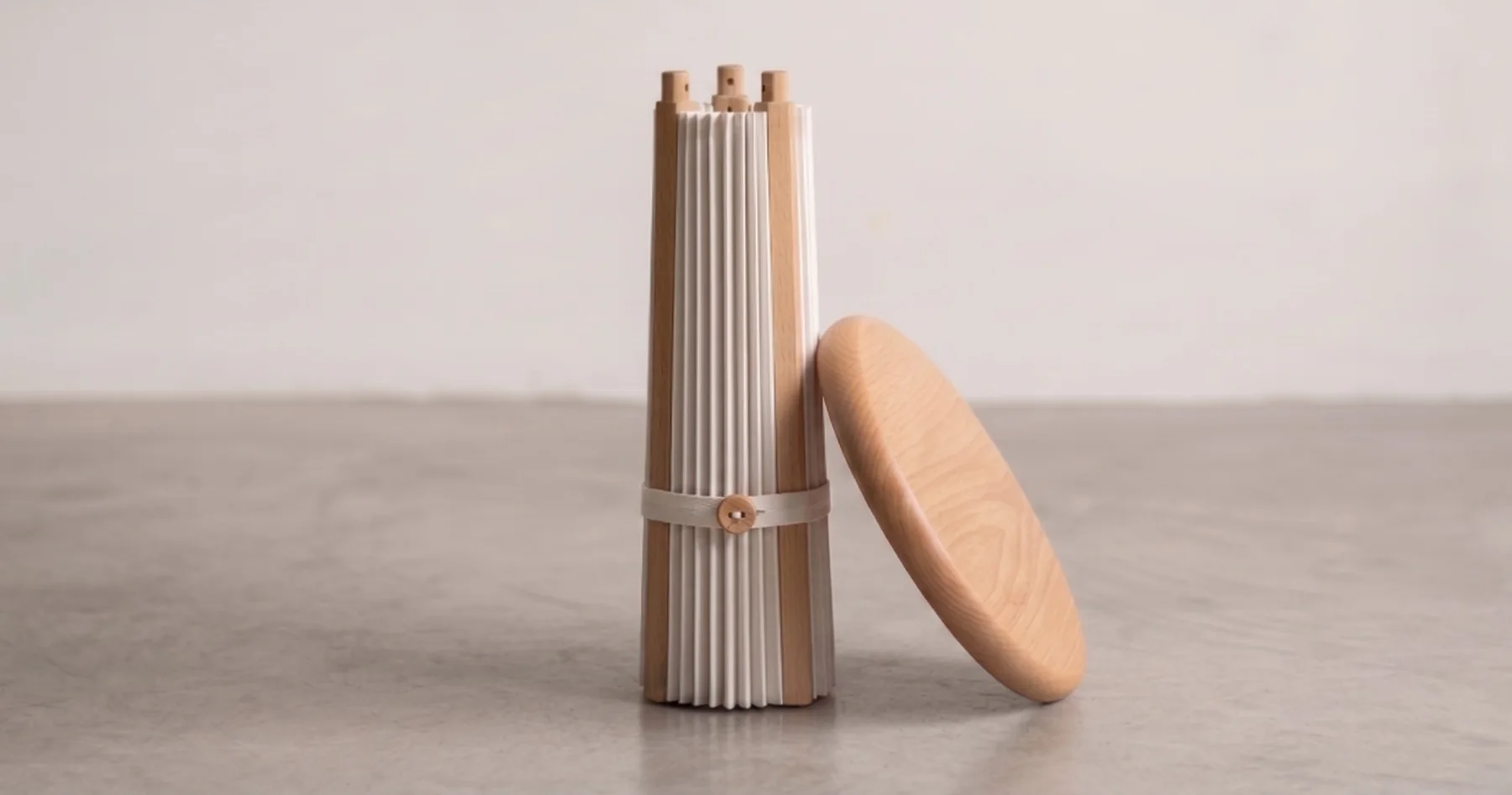 Folssé packed: the pleated shell rolled and strapped beside the seat